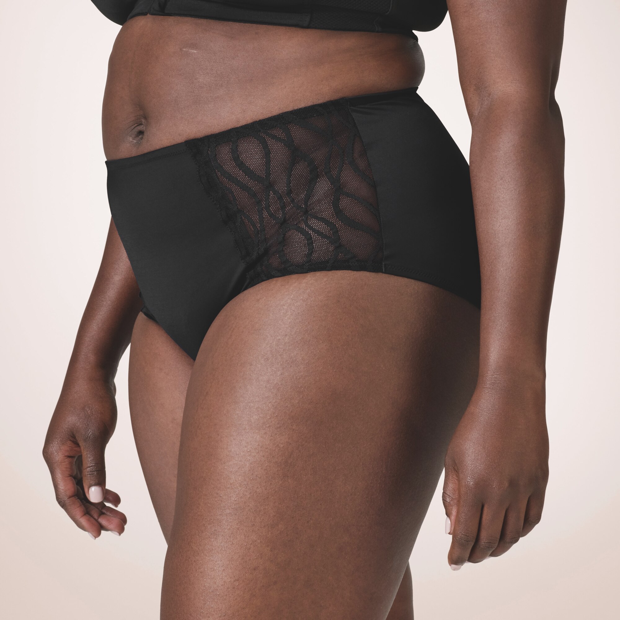 Cueca TENA Silhouette lavável vista de lado — lingerie absorvente com proteção integrada